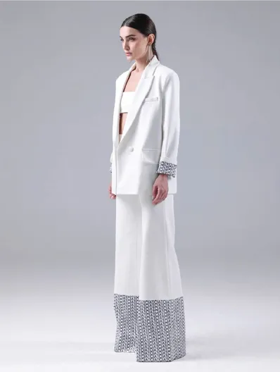 White suit with printed hem, side